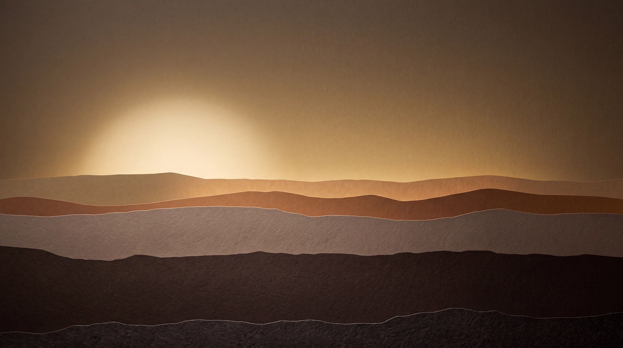 A valley in golden haze, hills fading into the distance